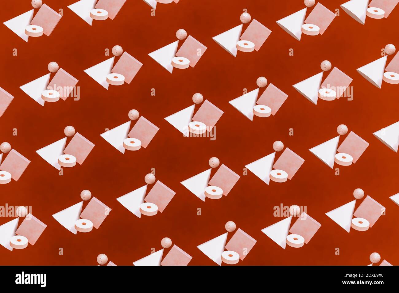 Pattern of geometric shapes hovering against red background Stock Photo