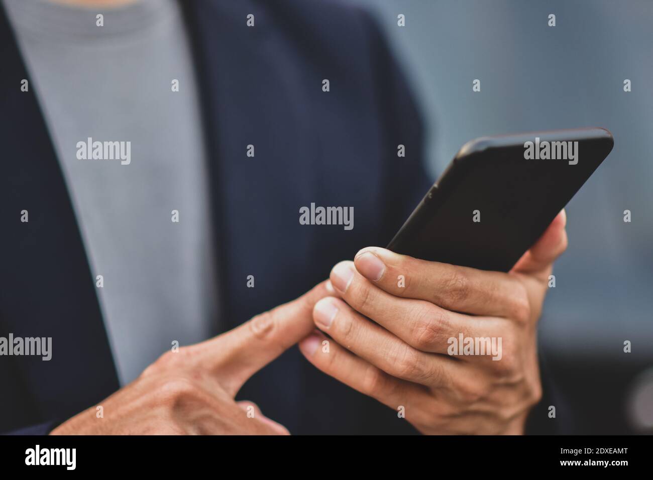 Business people holding cell phone or mobile smart phone technology