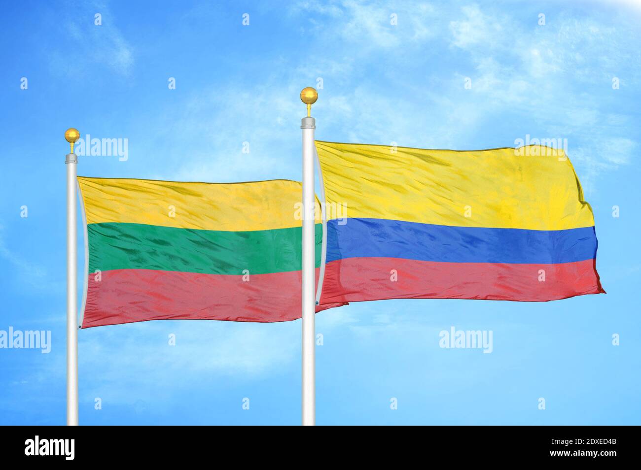 Lithuania and Colombia two flags on flagpoles and blue sky Stock Photo