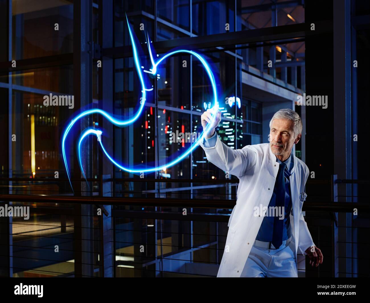 Male gastroenterologist light painting esophagus in laboratory at hospital Stock Photo