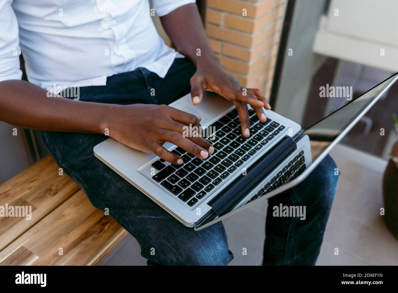 Businessman typing on laptop while working from home Stock Photo
