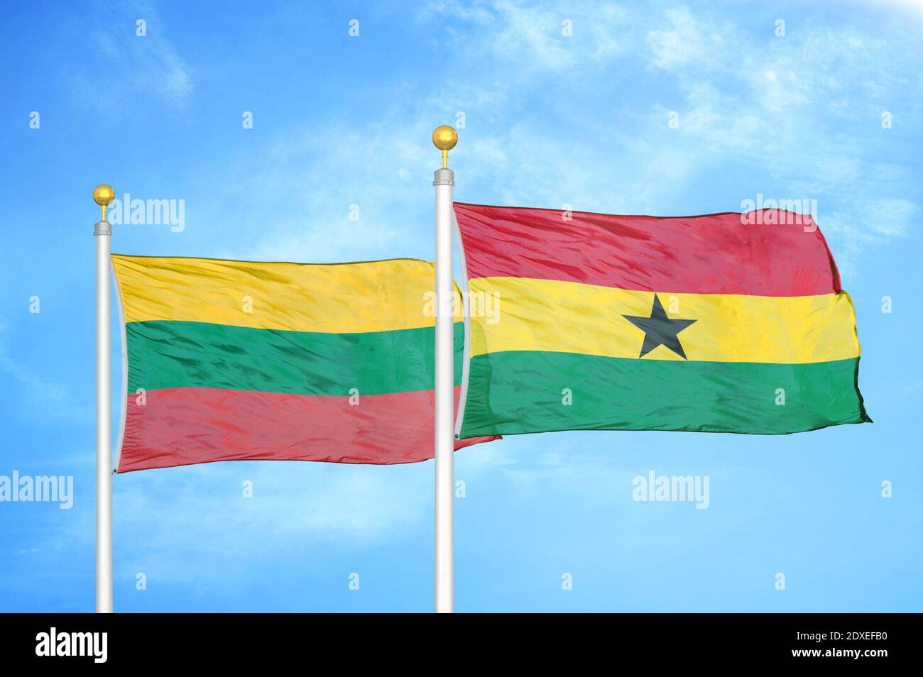 Lithuania and Ghana two flags on flagpoles and blue sky Stock Photo