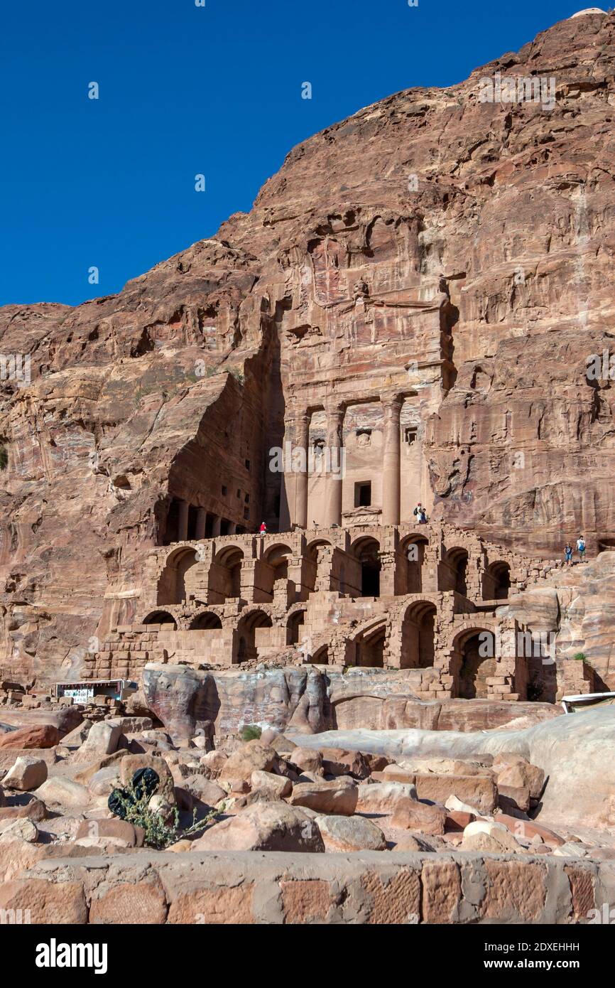 The ruins of the Urn Tomb, one of the Royal Tombs at the ancient site of Petra in Jordan. The tomb is located above Facades Street on the cliff face. Stock Photo