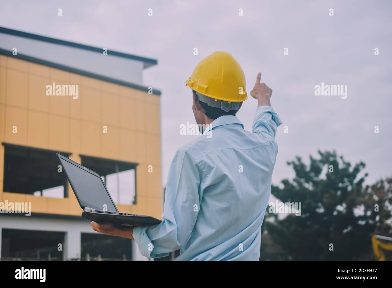 Project Engineering construction use computer notebook working on site management Stock Photo