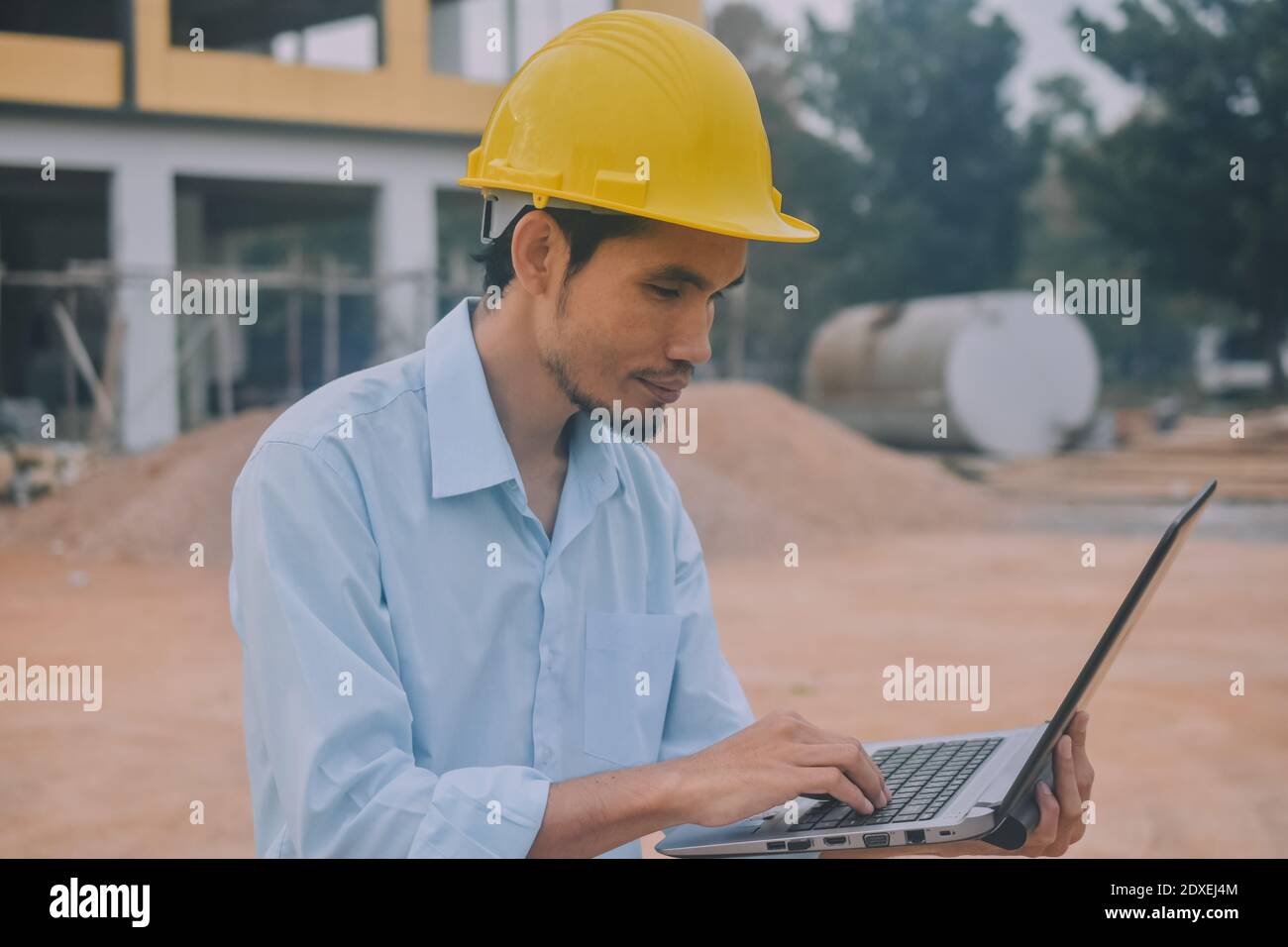 Project Engineering construction use computer notebook working on site management Stock Photo