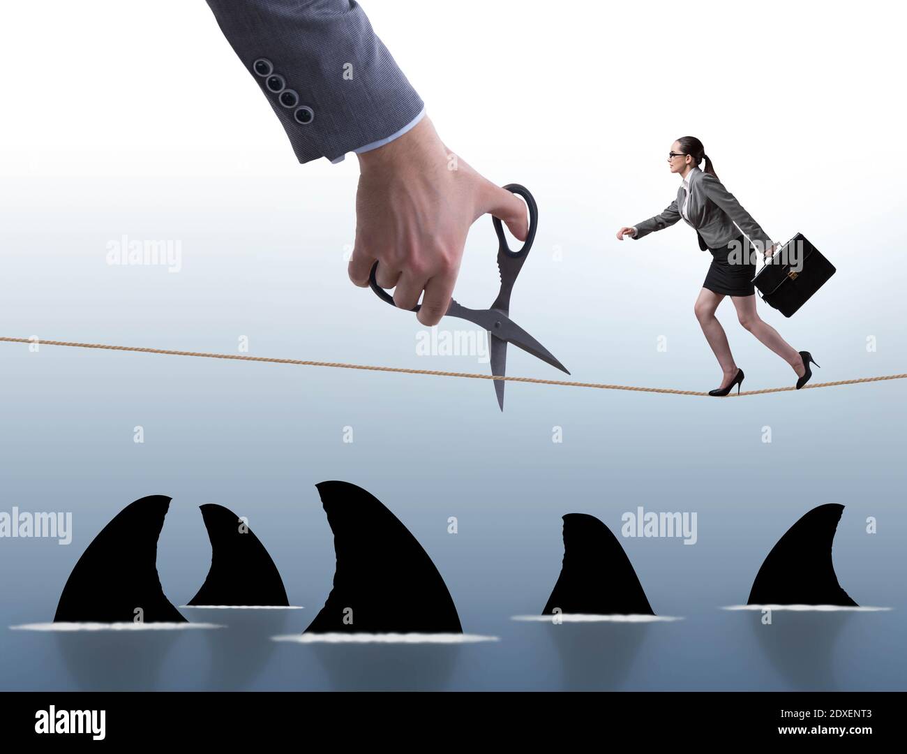 Hand Cutting Rop The hand cutting rope in business risk concept Stock Photo - Alamy