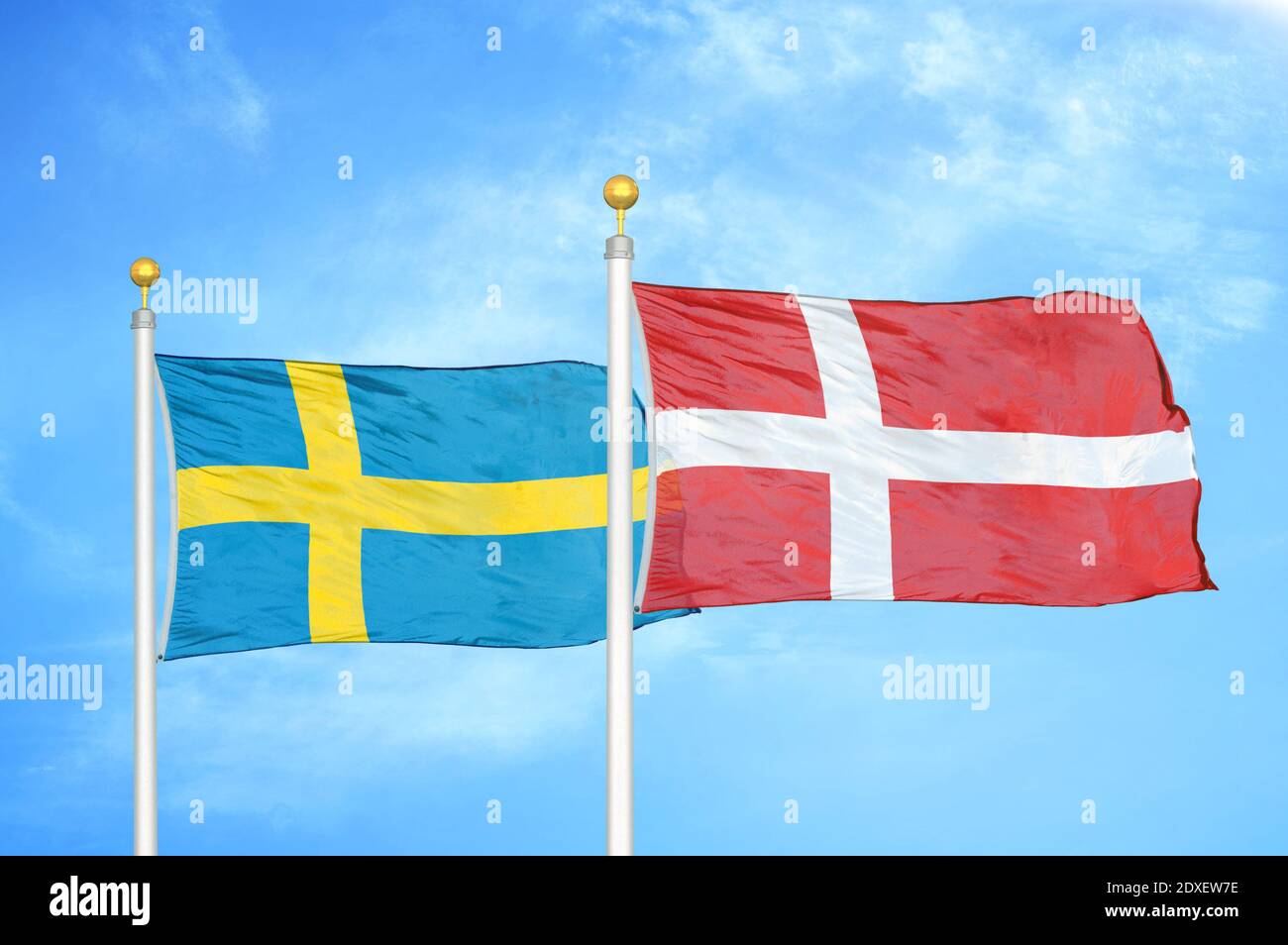 Sweden and Denmark two flags on flagpoles and blue sky Stock Photo - Alamy