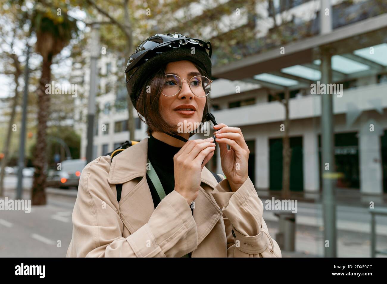 Woman cycling helmet city hi-res stock photography and images - Alamy