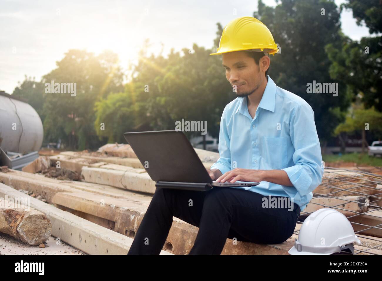 Engineering use computer notebook presentation at work place building estate construction background Stock Photo