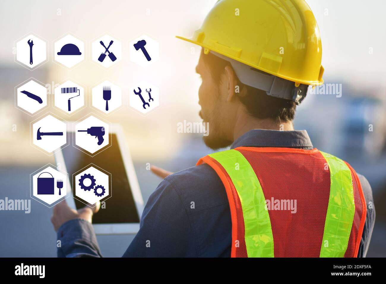 Construction Engineering holding tablet and choice tools equipment ...