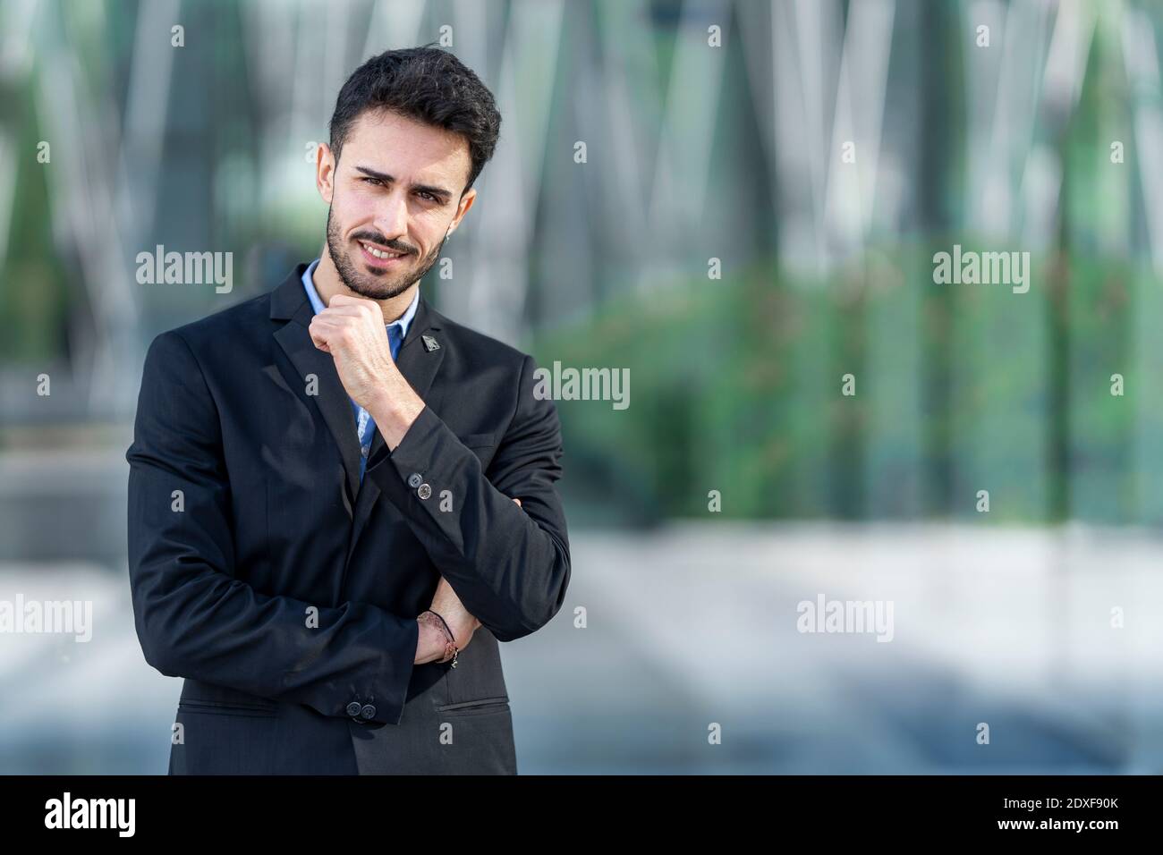Businessman staring while standing outdoors Stock Photo