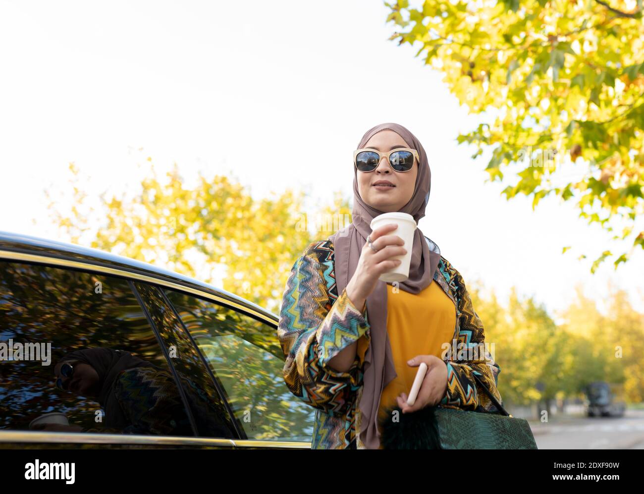 Young woman wearing hijab drinking hi-res stock photography and images ...