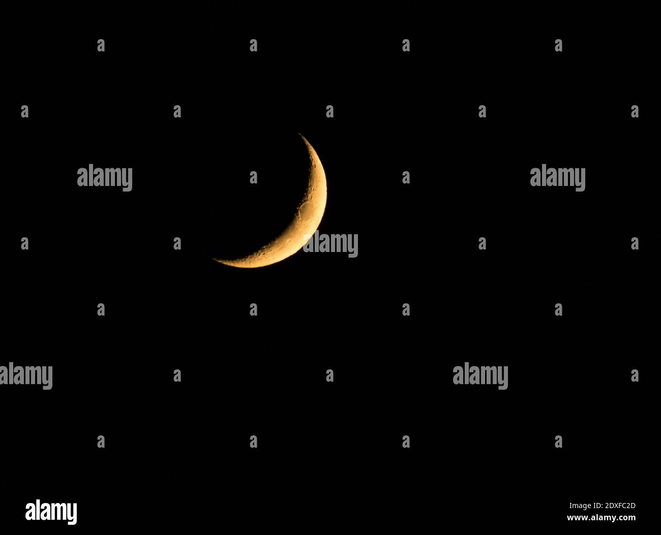 Waxing Crescent moon glowing against pitch black sky at night Stock Photo Alamy