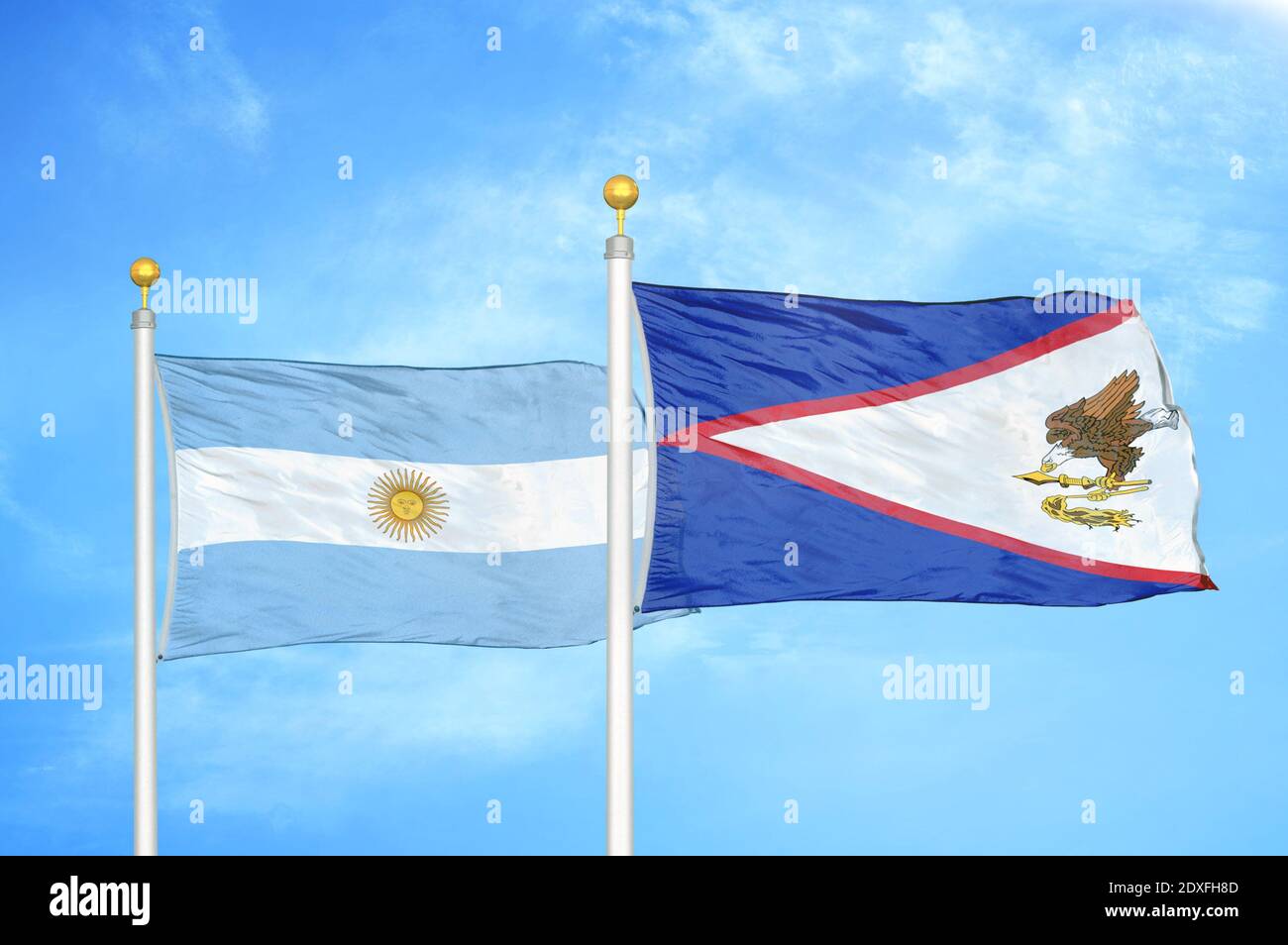 Argentina and American Samoa two flags on flagpoles and blue sky Stock Photo
