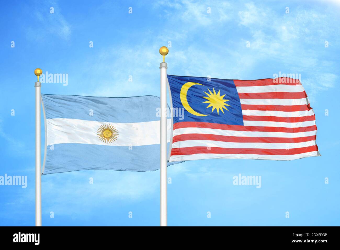 Argentina and Malaysia two flags on flagpoles and blue sky Stock Photo ...