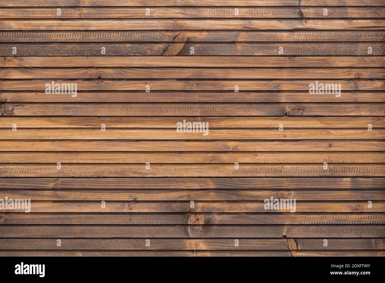 A Fine wood background in dark brown tone. in horizontal position. texture and detail of wood fence. A fine detail background for abstract design. Woo Stock Photo