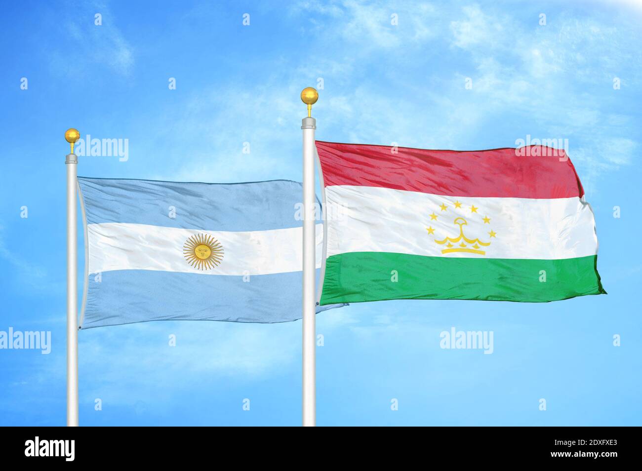 Argentina and Tajikistan two flags on flagpoles and blue sky Stock Photo