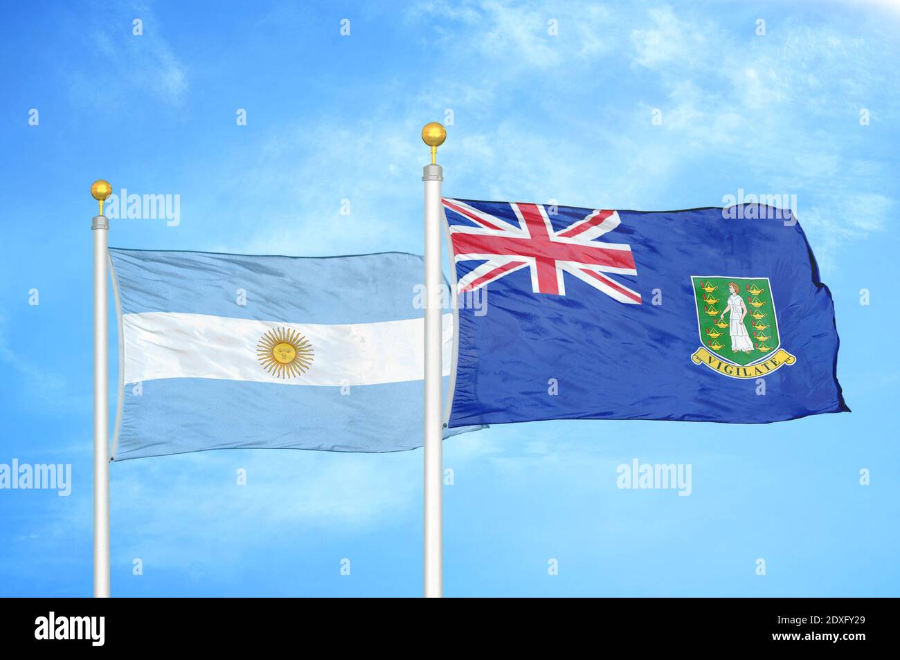 Argentina and Virgin Islands British two flags on flagpoles and blue sky Stock Photo