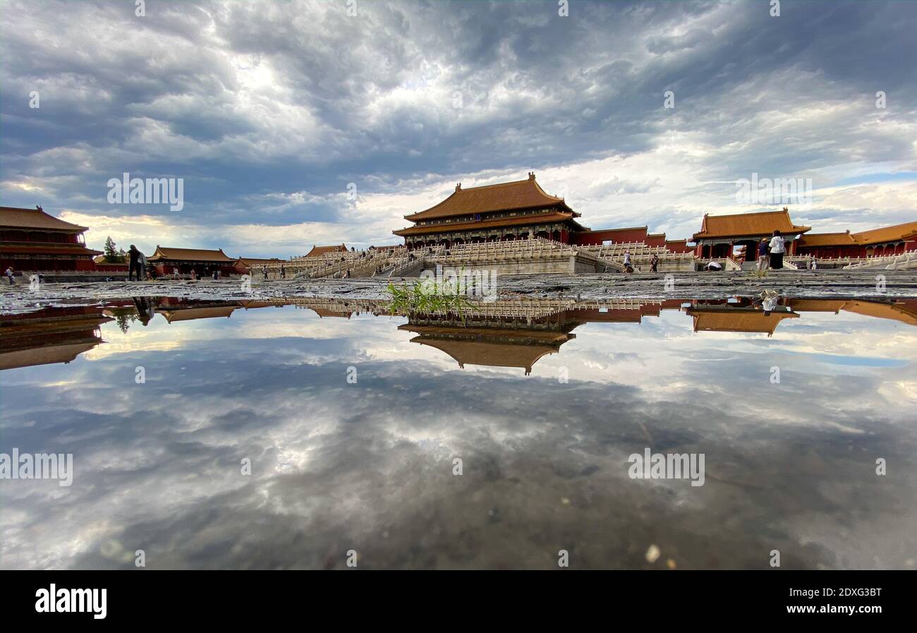 (201224) -- BEIJING, Dec. 24, 2020 (Xinhua) -- Photo taken with a mobile phone shows a view in the Palace Museum after rainfall in Beijing, capital of China, Sept. 1, 2020. The year 2020 marks the 600th anniversary of the Forbidden City. Constructed from 1406 to 1420, the Forbidden City measures 961 meters from north to south and 753 meters from east to west, spanning an area of around 720,000 square meters. Featuring red walls and yellow glazed roof tiles, it represents the culmination of traditional Chinese palatial architecture, influencing cultural and architectural developments in East As Stock Photo