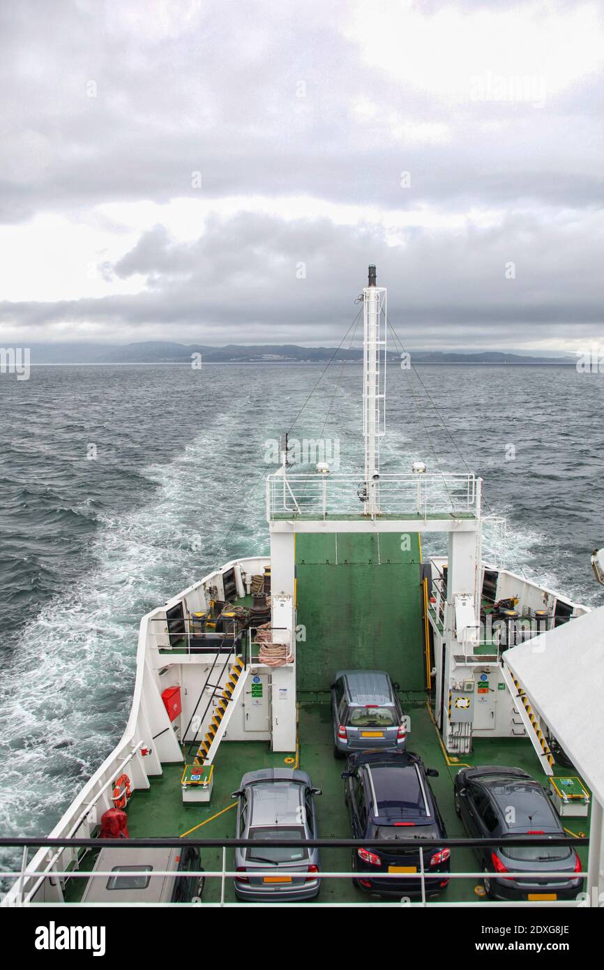 Ferry between islands in Scotland carrying passengers and cars Stock