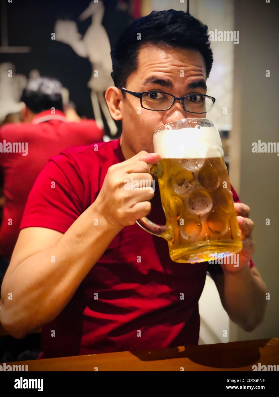 Portrait Of A Man Drinking Beer In Big Glass Stock Photo - Alamy