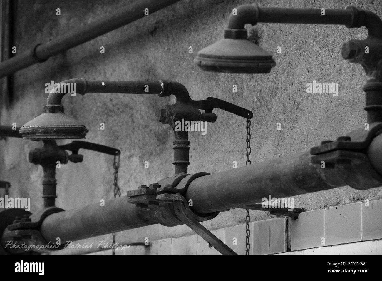 Pipes Against Wall Stock Photo Alamy