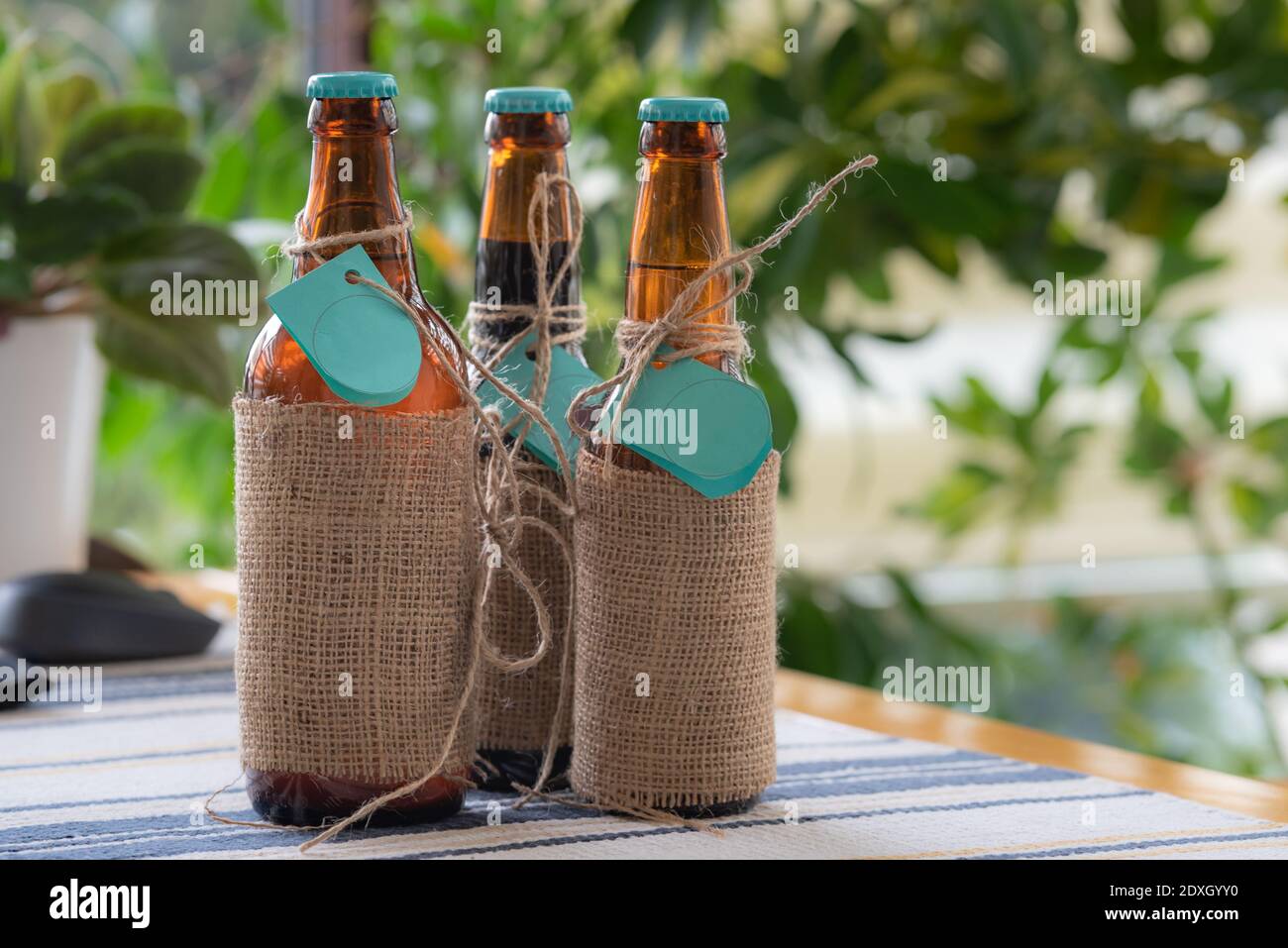 A bottle of delicious-looking craft beer on a table, waiting to be consumed. Stock Photo