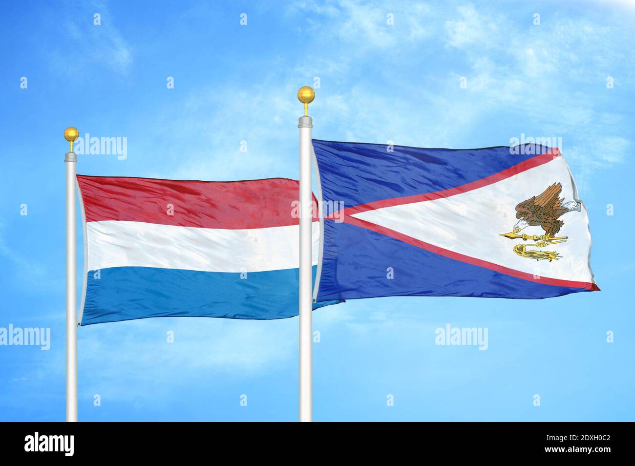 Netherlands and American Samoa two flags on flagpoles and blue sky Stock Photo