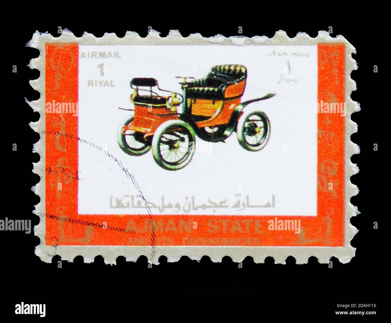 MOSCOW, RUSSIA - MARCH 30, 2019: A stamp printed in Ajman shows Old and racing cars, serie, circa 1973 Stock Photo