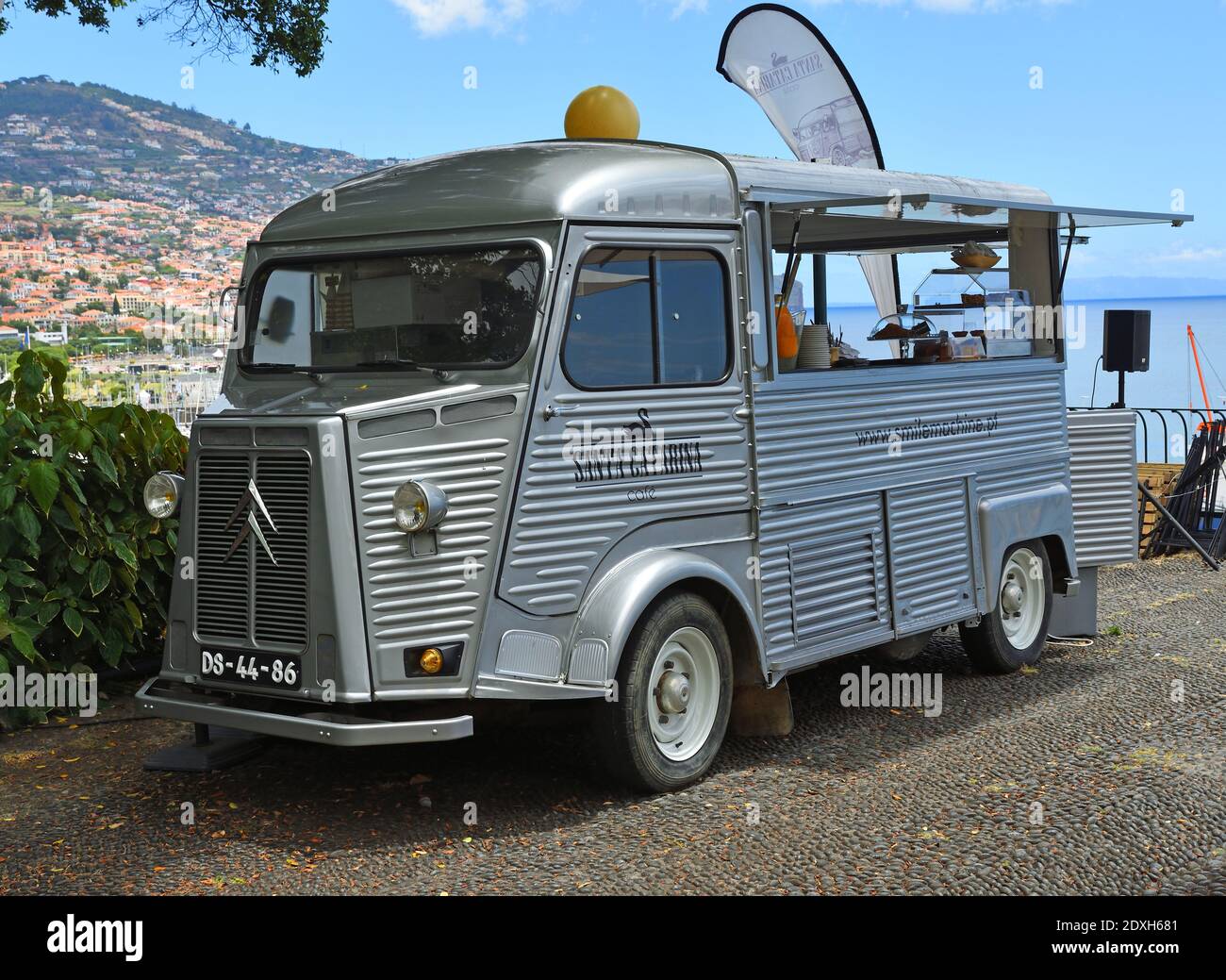 Classic Citroën van being used as a cafe in the park Funchal Madeira. Stock Photo
