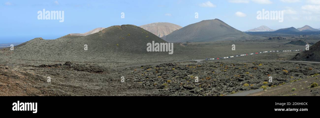 Cars  Queuing in Volcanic landscape of Lanzarote. Stock Photo