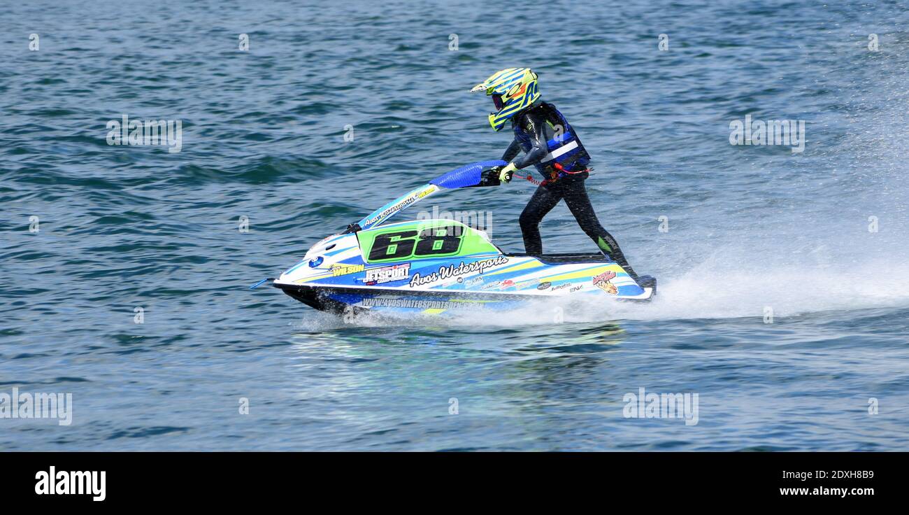 Young Jet Ski race competitor moving  at speed. Stock Photo