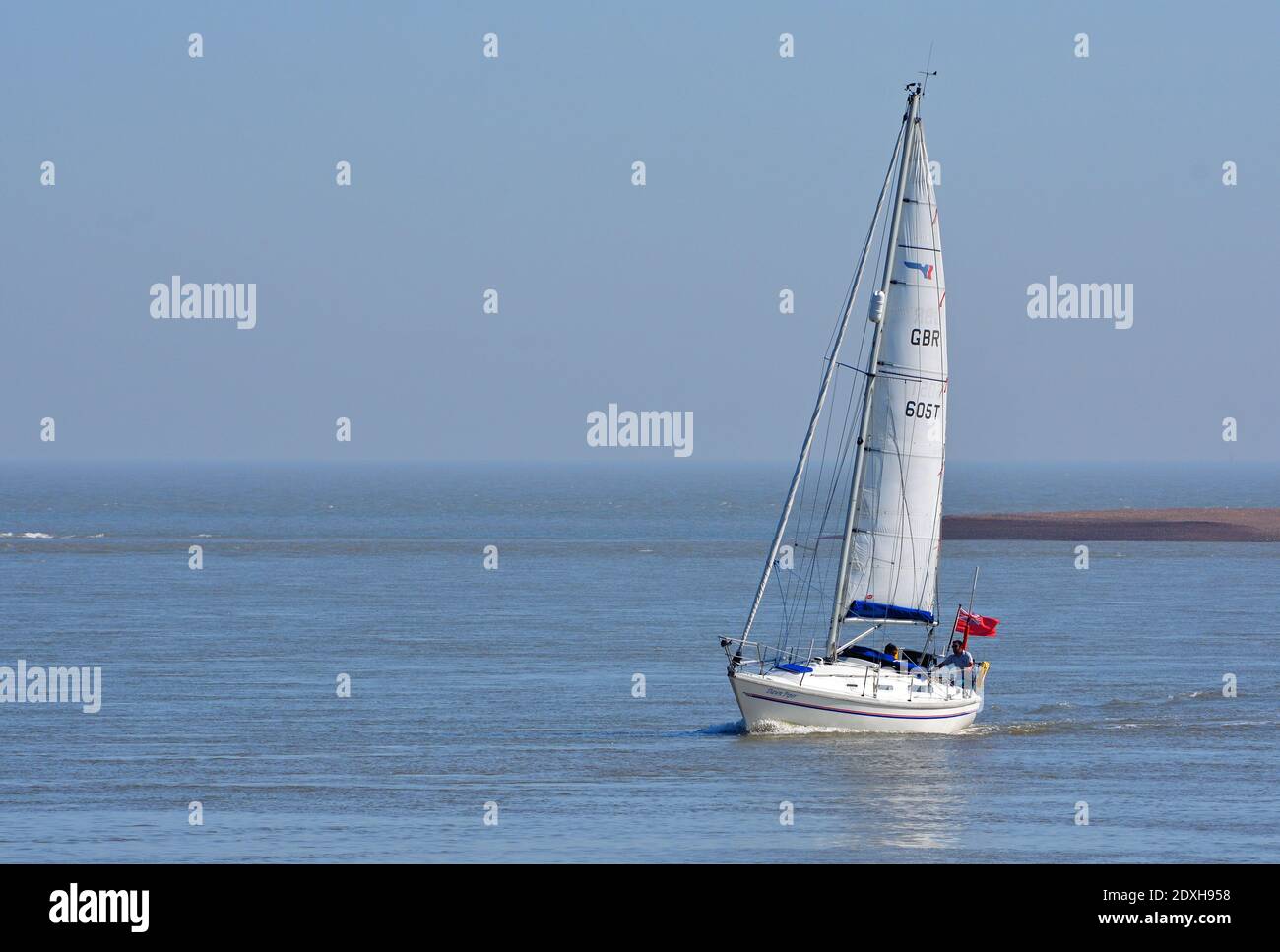 Yacht under sail at the estuary of the river Deben at Felixstowe Ferry. Stock Photo