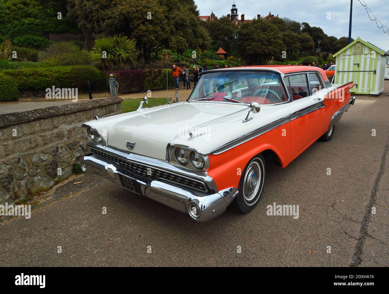 Classic American Ford Galaxie automobile parked in front of trees. Stock Photo