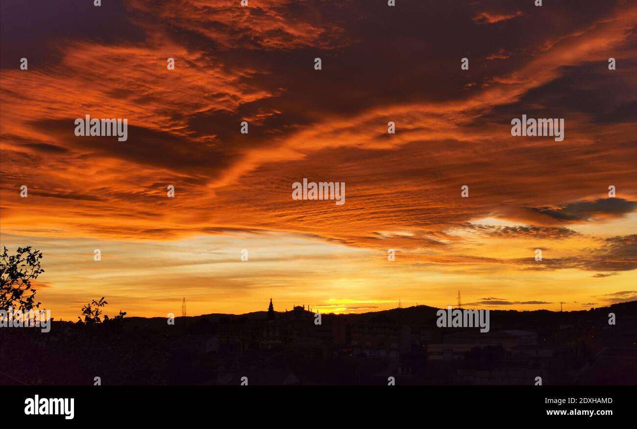 Silhouette Landscape Against Dramatic Sky During Sunset Stock Photo