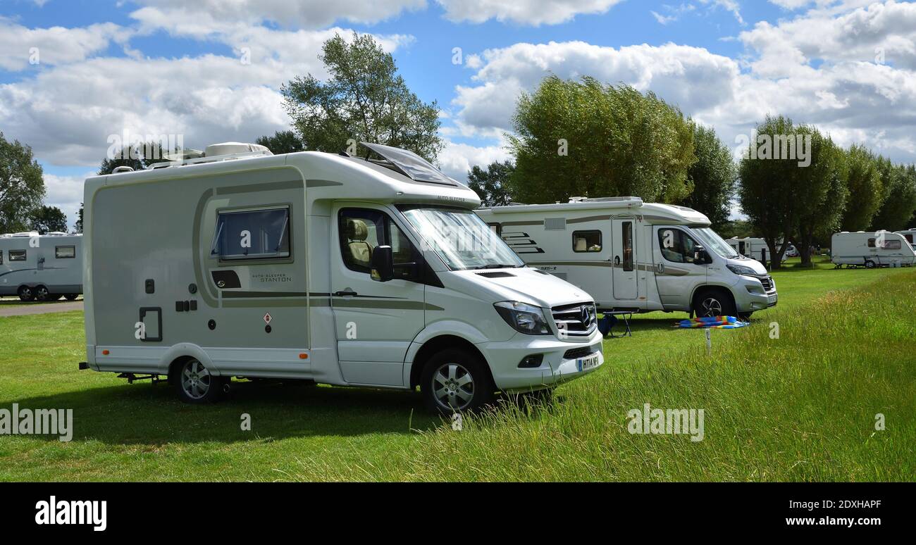 Two Large Camper Vans on campsite. Stock Photo