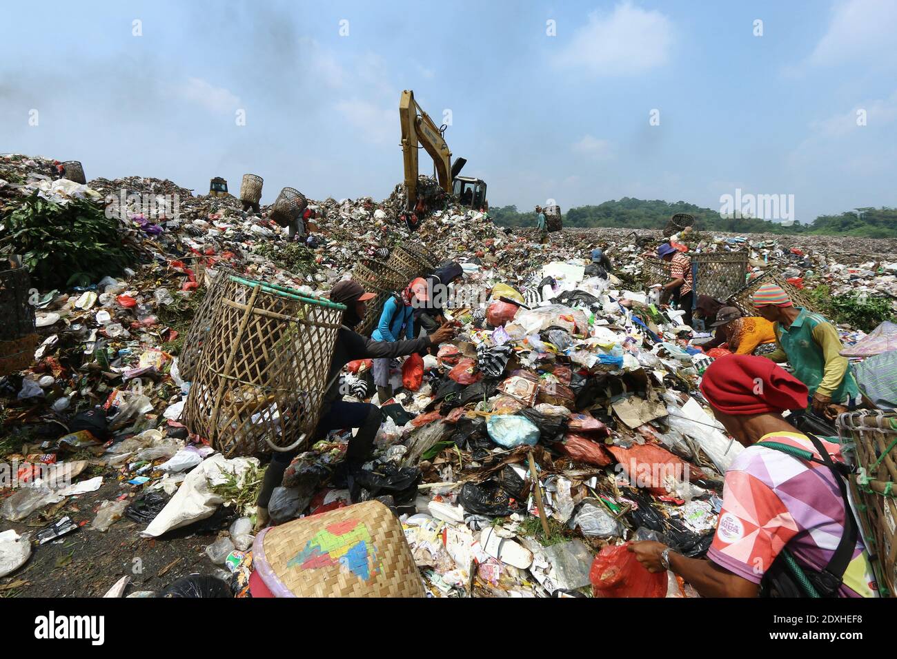 Scavengers are active in piles of rubbish in the landfill (TPA) of Galuga garbage, Cibungbulang, Bogor Regency, West Java. Stock Photo