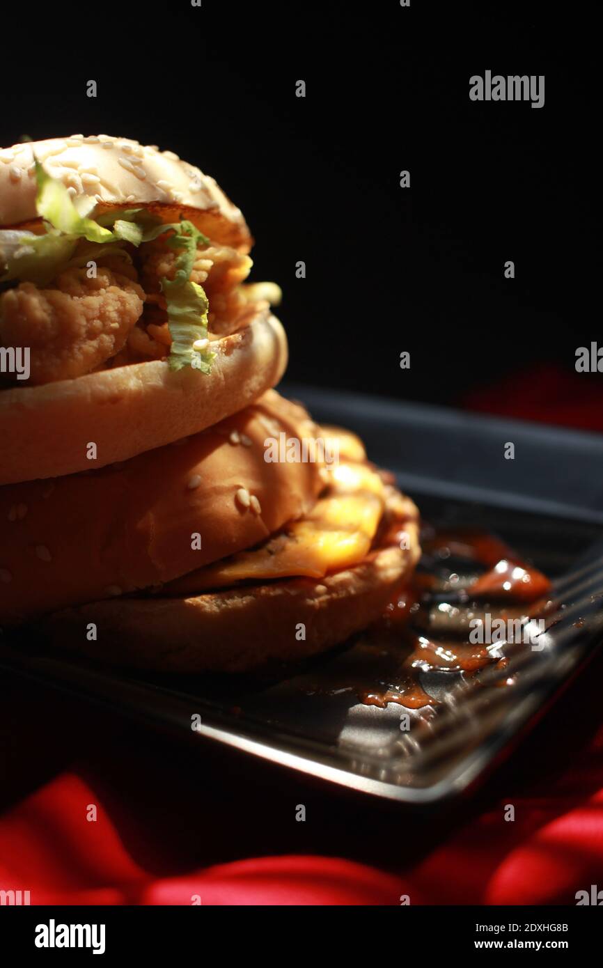 A Delicious Double Burger Conceptualized With A Luxurious Impression Stock Photo