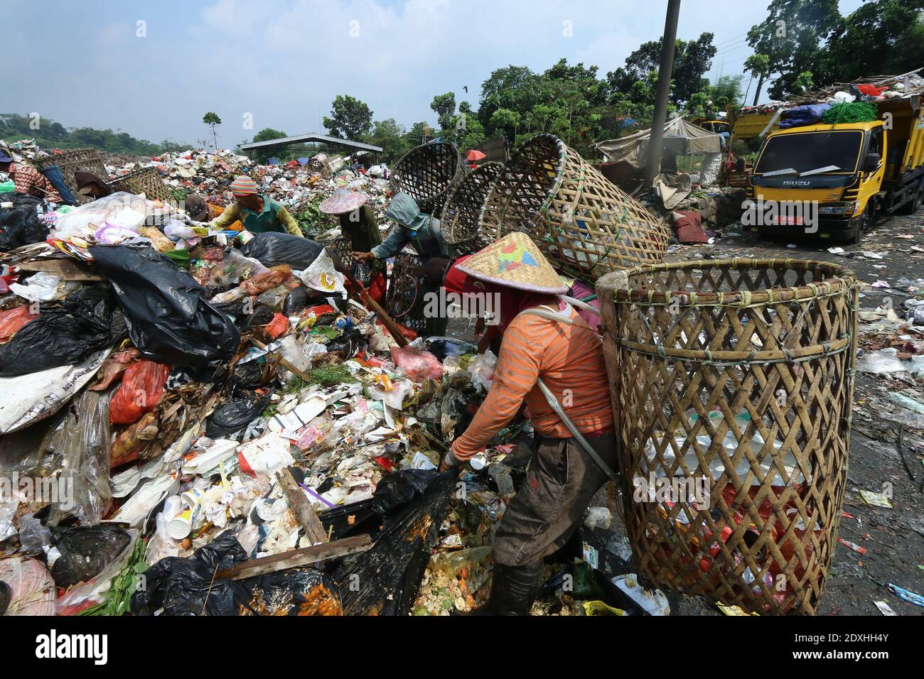 Scavengers are active in piles of rubbish in the landfill (TPA) of