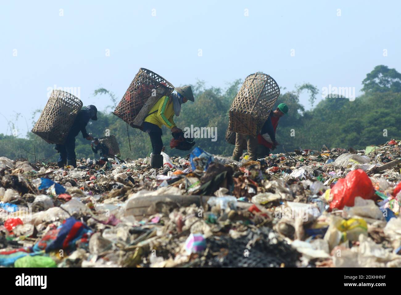 Scavengers are active in piles of rubbish in the landfill (TPA) of Galuga garbage, Cibungbulang, Bogor Regency, West Java. Stock Photo