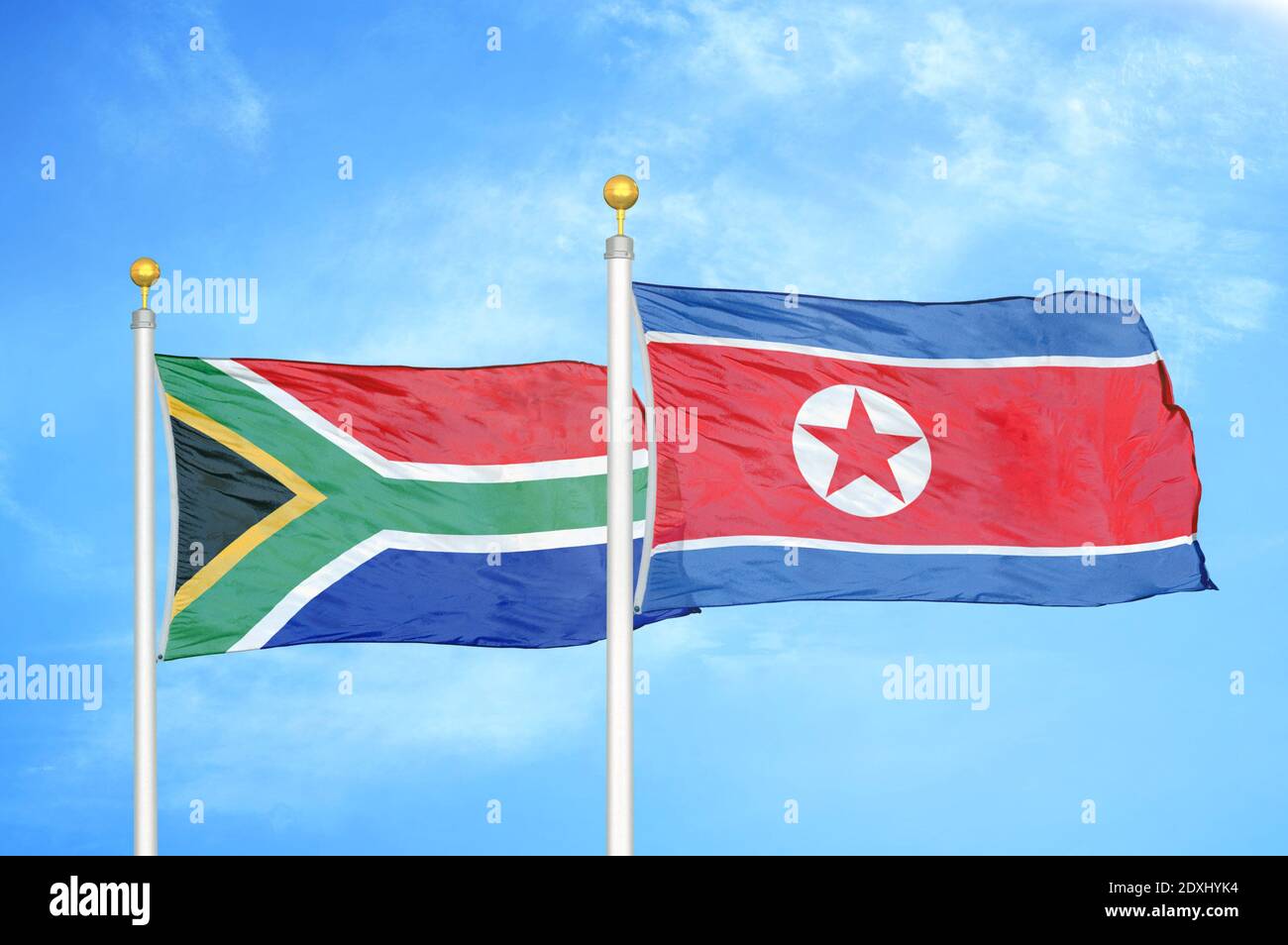 South Africa and North Korea two flags on flagpoles and blue sky Stock ...