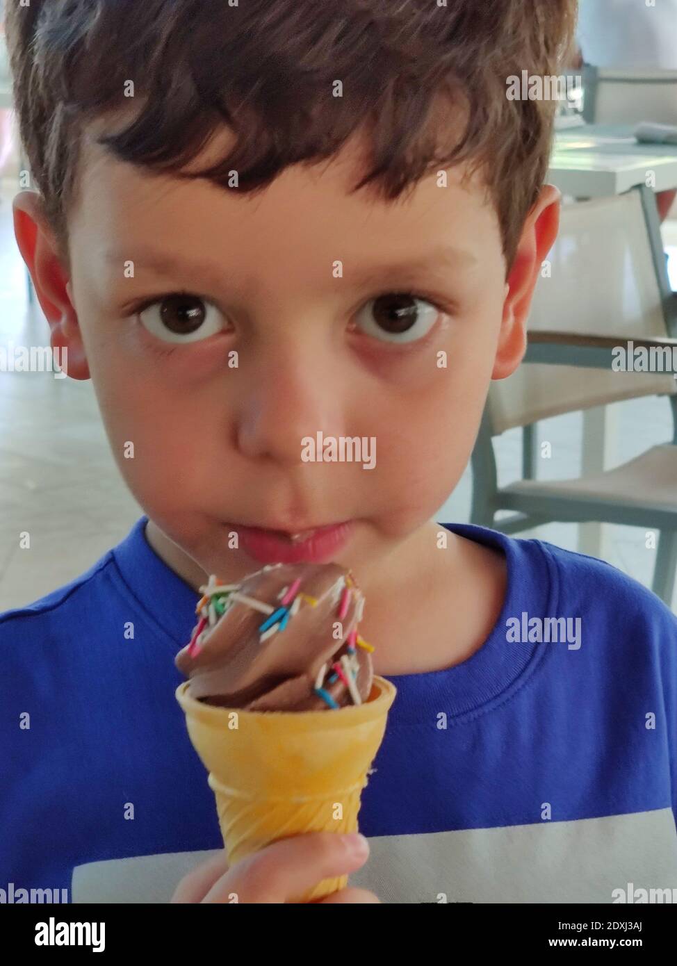 Portrait Of Cute Boy Eating Ice Cream Cone Stock Photo Alamy