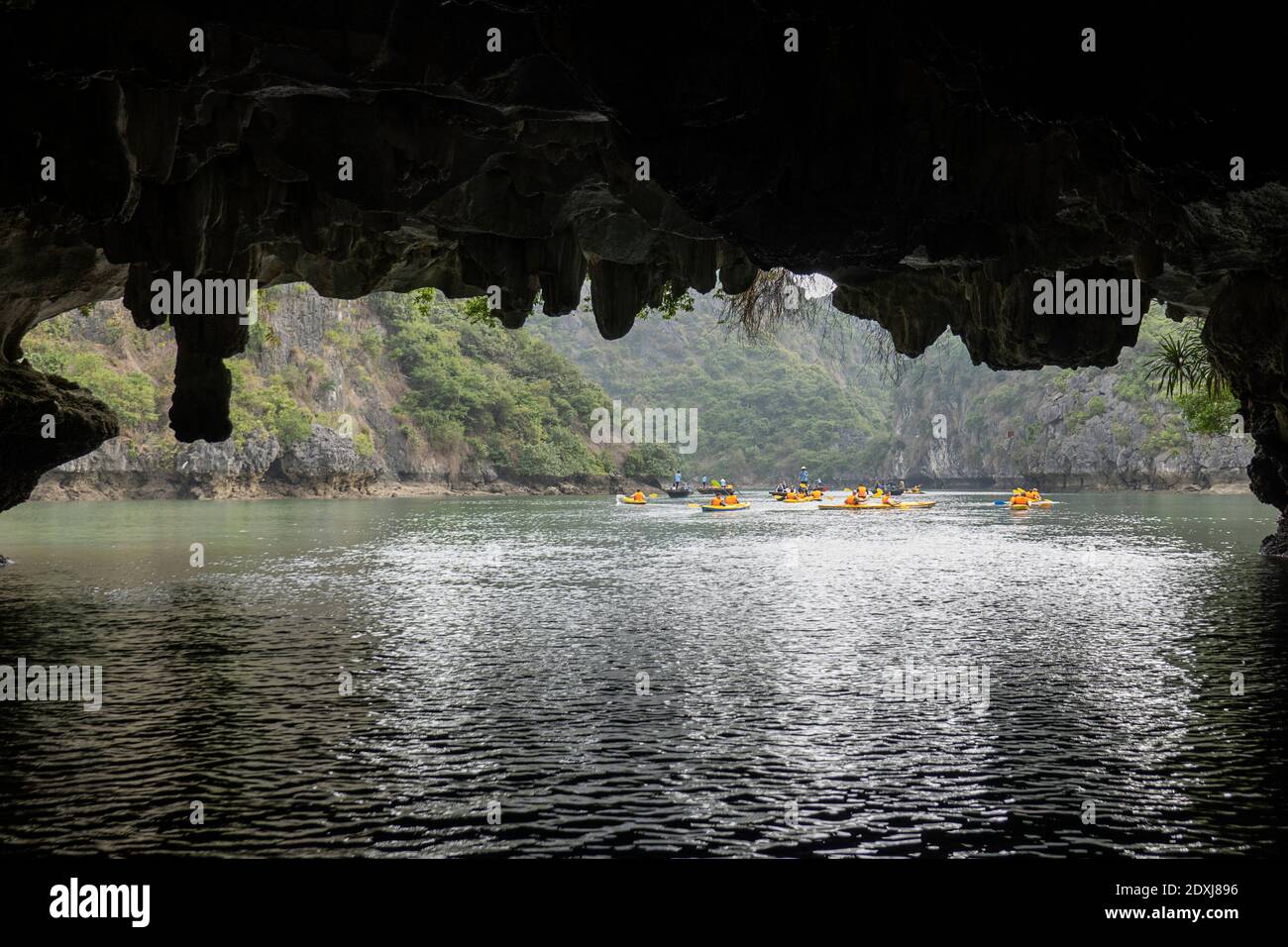 Kayakers paddling amongst the islands of Ha Long Bay Stock Photo
