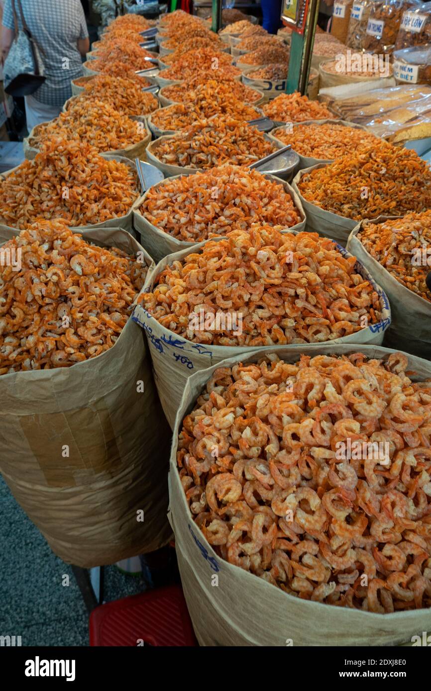 Baskets of dried shrimp at a market in Vietnam Stock Photo