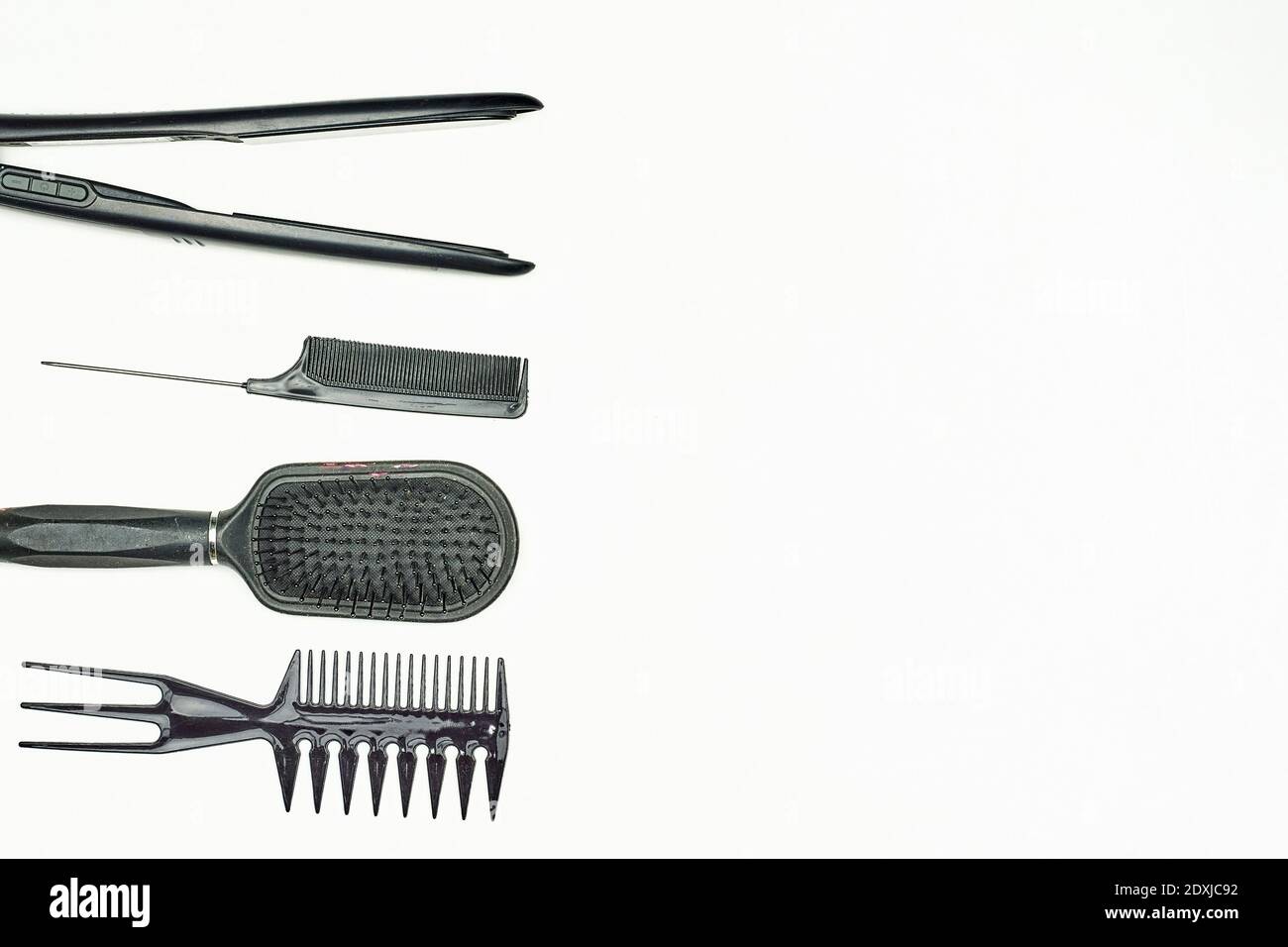 Female Hairdresser tools. Different types of combs and hair iron for