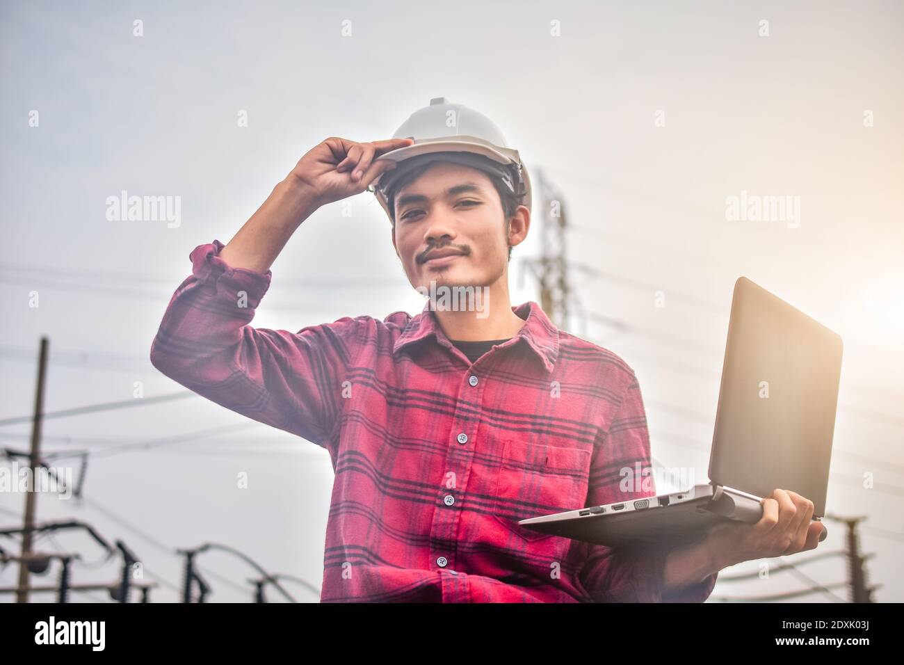 Engineer technician foreman Supervisor holding computer notebook at work place Power plant electric system background technology inspection Checking s Stock Photo