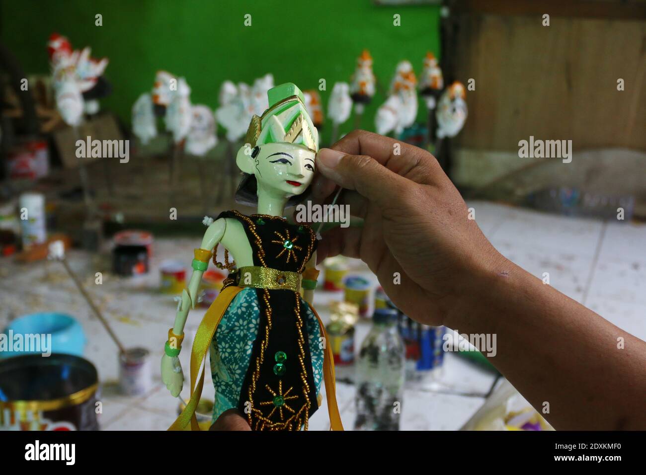 Workers make wooden puppets in Bogor City. This Indonesian-made puppet is in great demand by foreign tourists both in Asia and Europe Stock Photo
