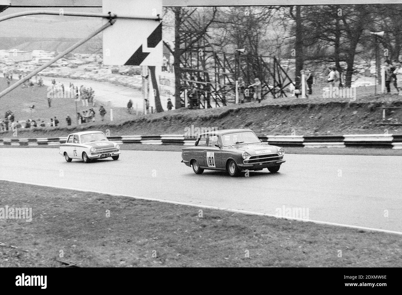 Vintage black and white photograph taken in 1983 showing Lotus Corvinas UBM 1, race number 180, and JAB 17C, race number 175,  racing at the Brands Hatch circuit inn England. Stock Photo