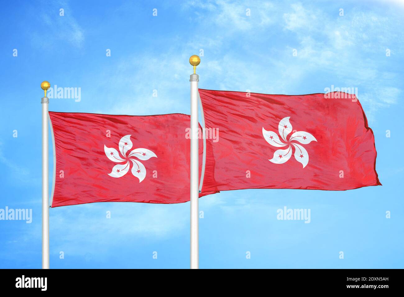 Hong Kong two flags on flagpoles and blue cloudy sky Stock Photo