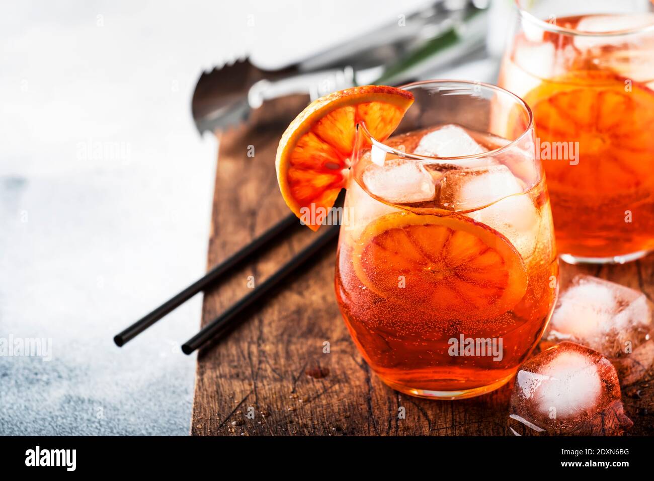 Aperol spritz cocktail in glass with sparkling wine, liqueur, ice and